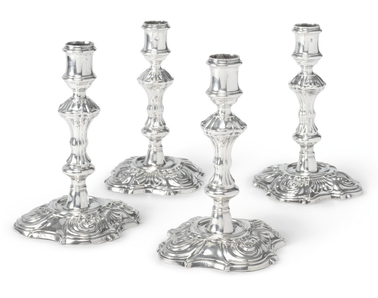A set of four George II silver candlesticks, Phillips Garden by Anonymous