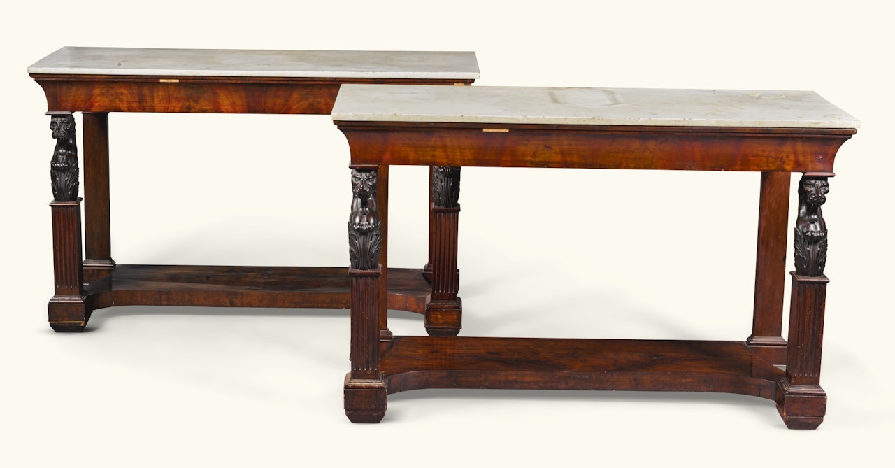 A set of four Italian mahogany console tables by Anonymous