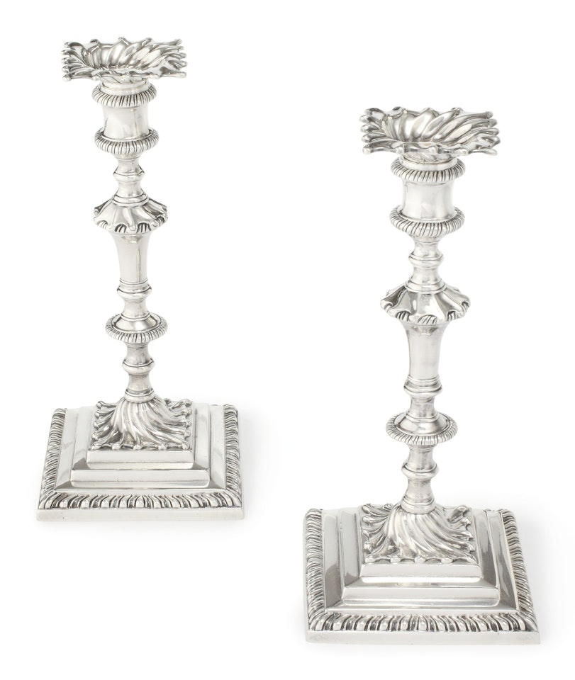 A pair of George III silver candlesticks by Anonymous