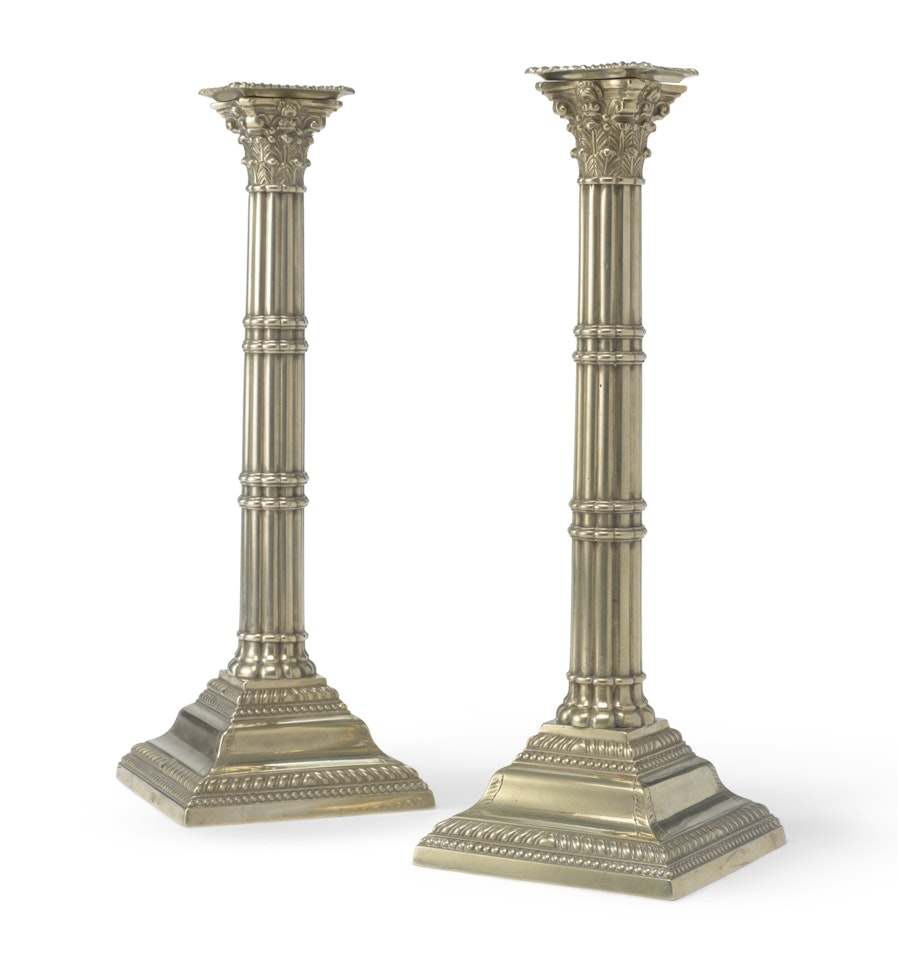 A pair of paktong cluster column candlesticks by Anonymous