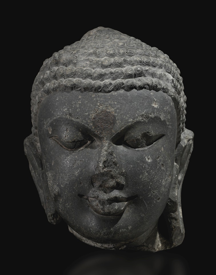 A CHLORITE HEAD OF BUDDHA
 by Anonymous