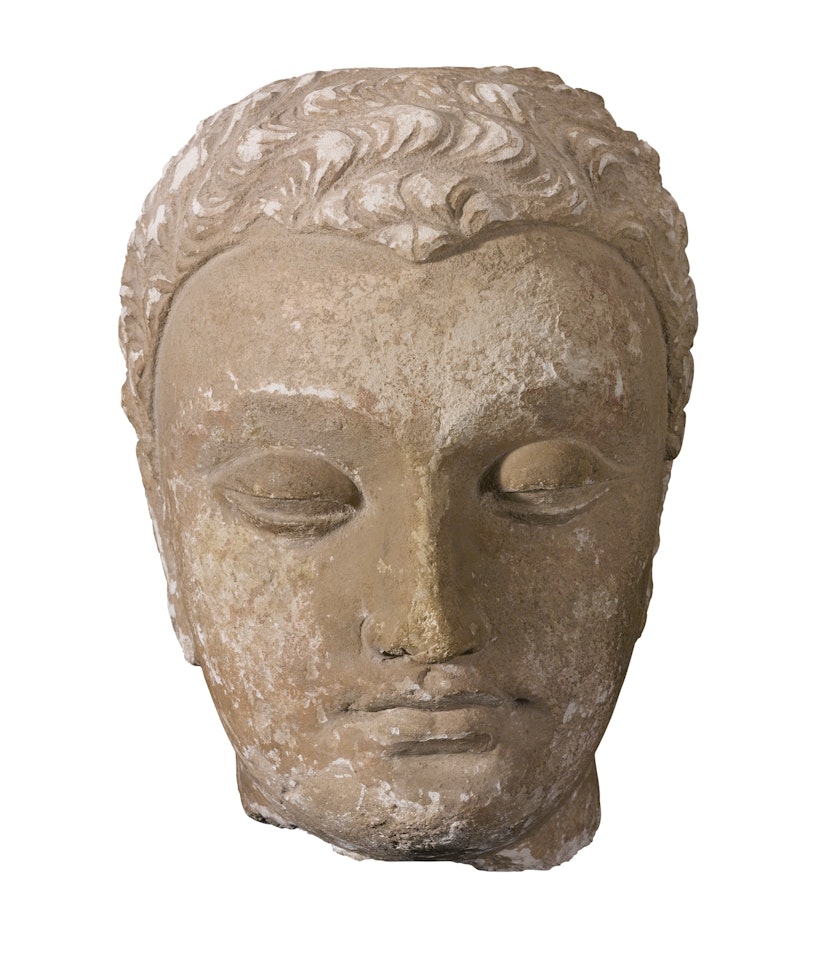 A LARGE STUCCO HEAD OF BUDDHA  by Anonymous