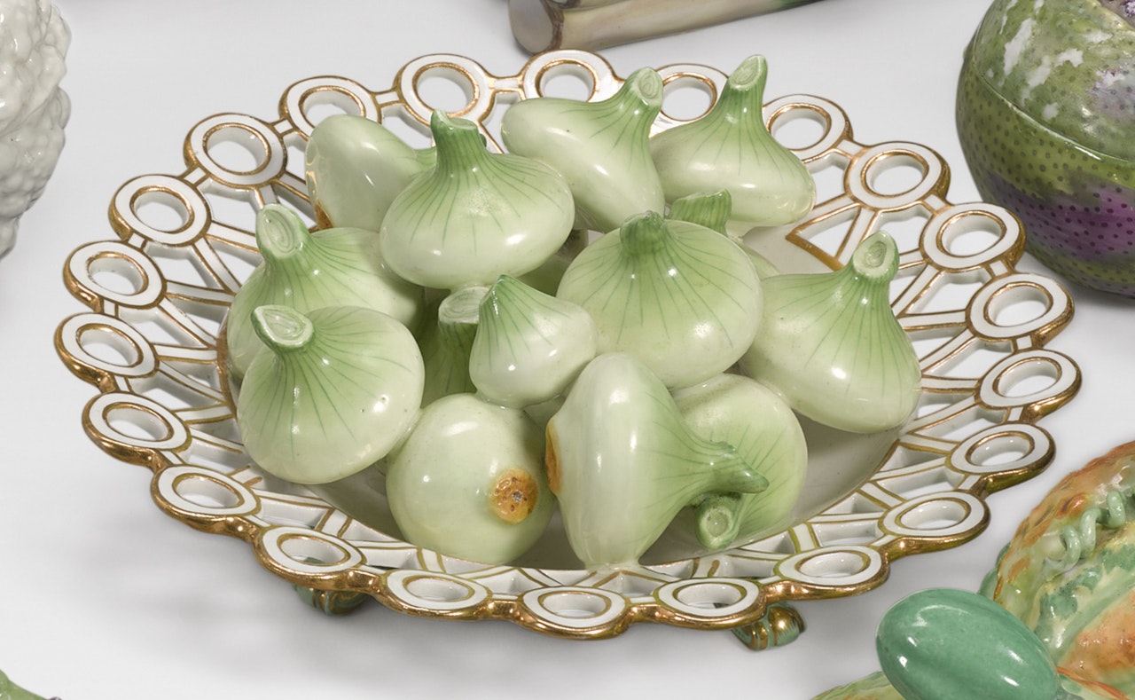 A Minton trompe-l'oeil dish of onions by Anonymous