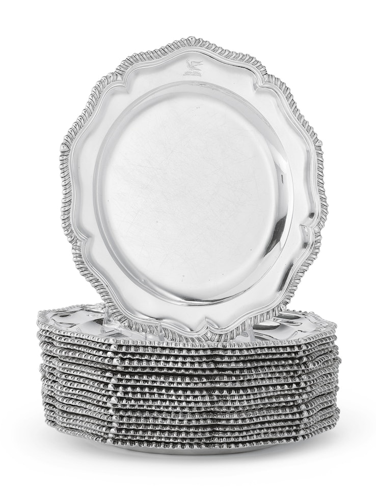 A set of eighteen Victorian silver dinner plates by Anonymous
