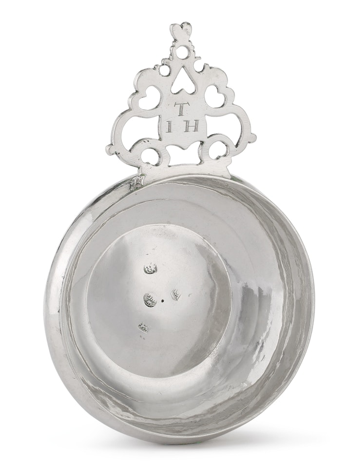 A William and Mary silver bleeding bowl or porringer by Anonymous