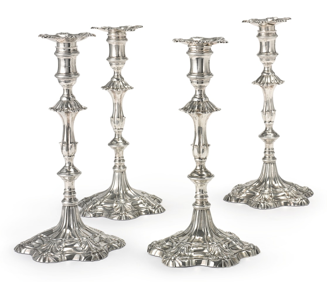 Two pairs of George III silver candlesticks by Anonymous