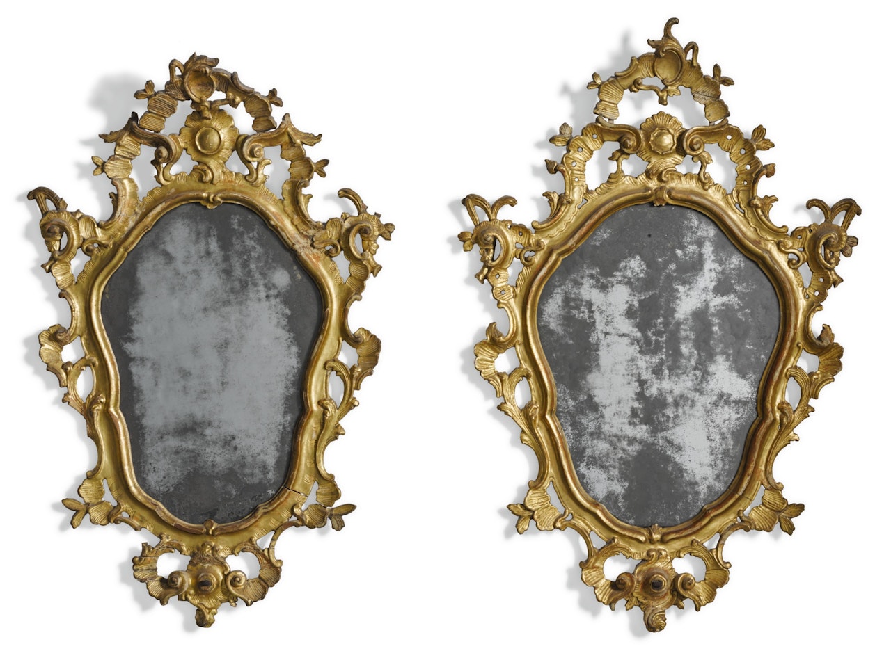 A pair of Italian rococo carved giltwood mirrors by Anonymous