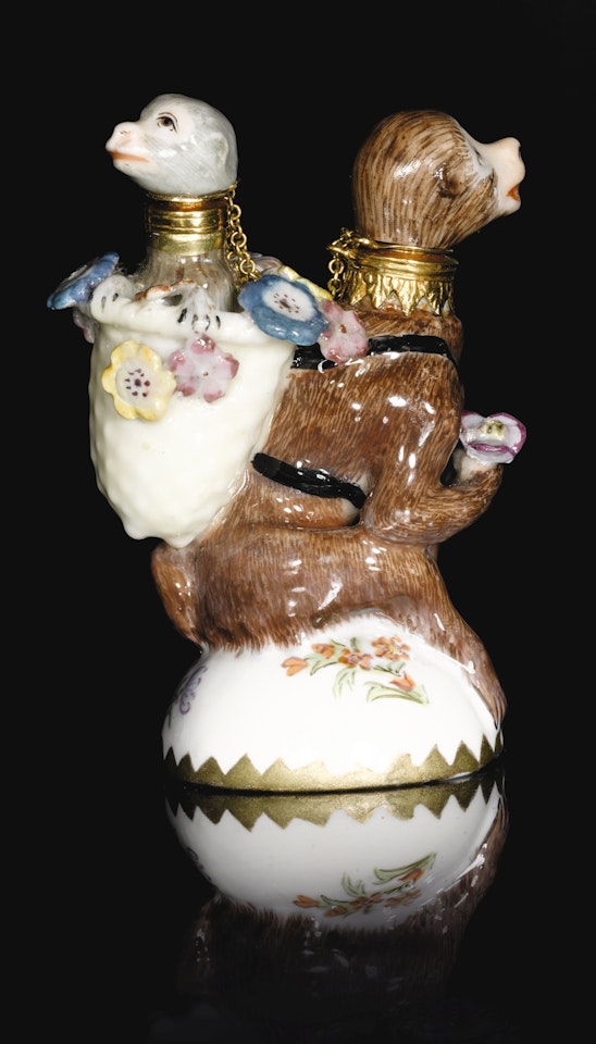 A Chelsea gilt-metal mounted double scent bottle in the form of a monkey and its young by Anonymous