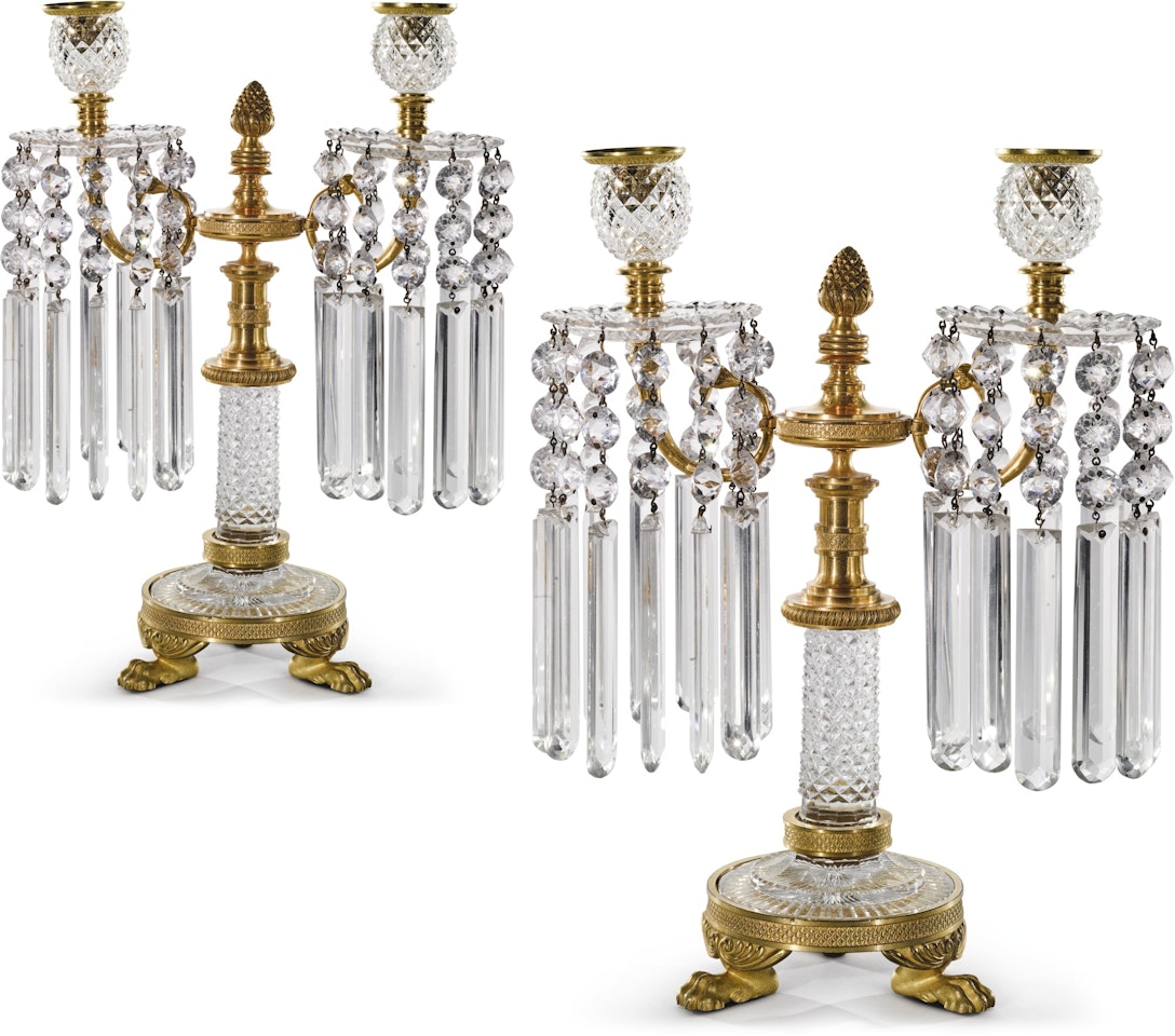 A pair of Regency cut-glass and ormolu two light candelabra in the manner of John Blades by Anonymous