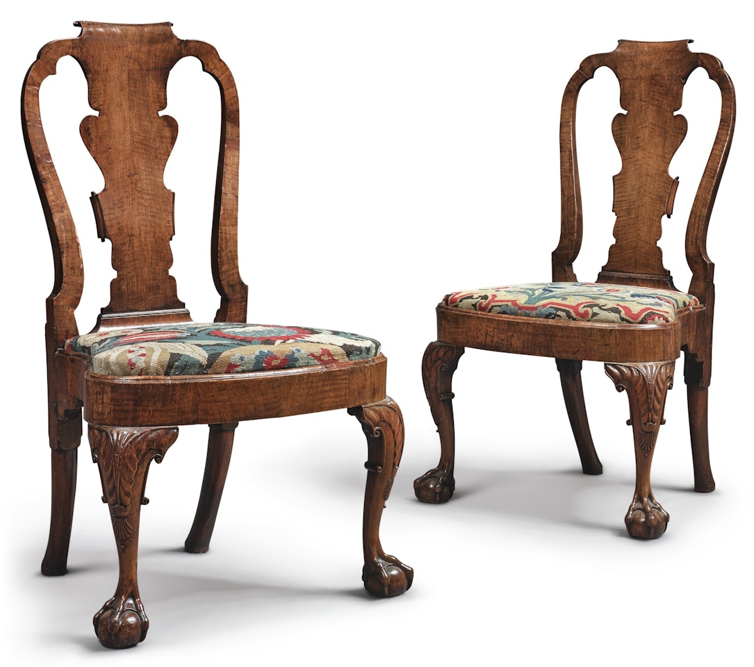 A pair of George II walnut side chairs by Anonymous