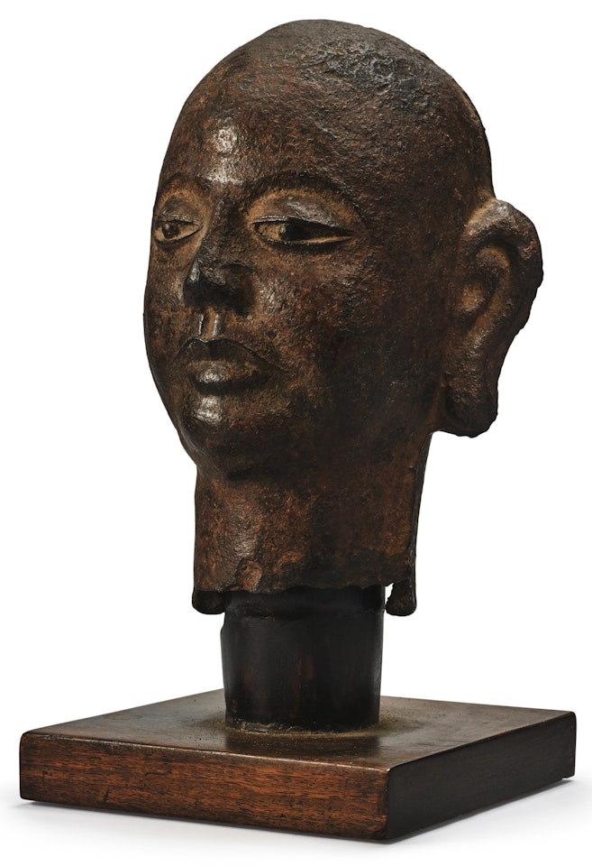 AN IRON HEAD OF A LUOHAN by Anonymous