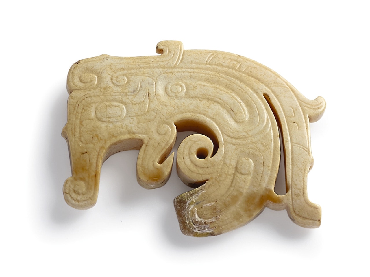 A RARE CALCIFIED JADE 'DRAGON' PENDANT by Anonymous