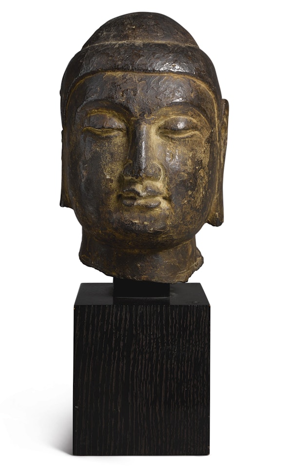 A RARE LIMESTONE HEAD OF BUDDHA by Anonymous