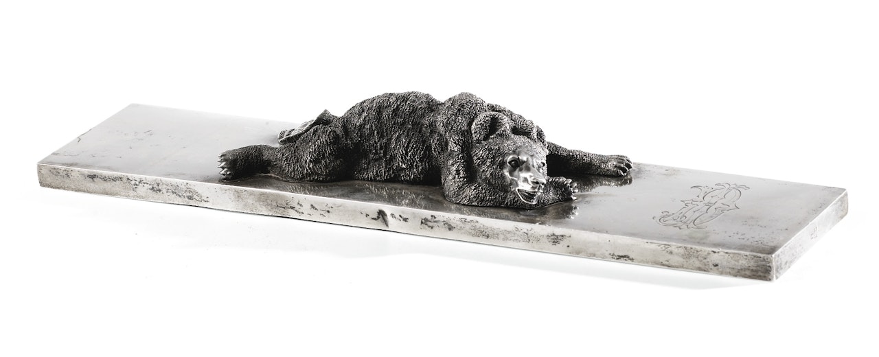 A Russian silver paper-weight shaped as a lying bear, Saint-Petersburg, 1889, maker's mark possibly that of Vassily Kangin, assay-master N.E by Anonymous