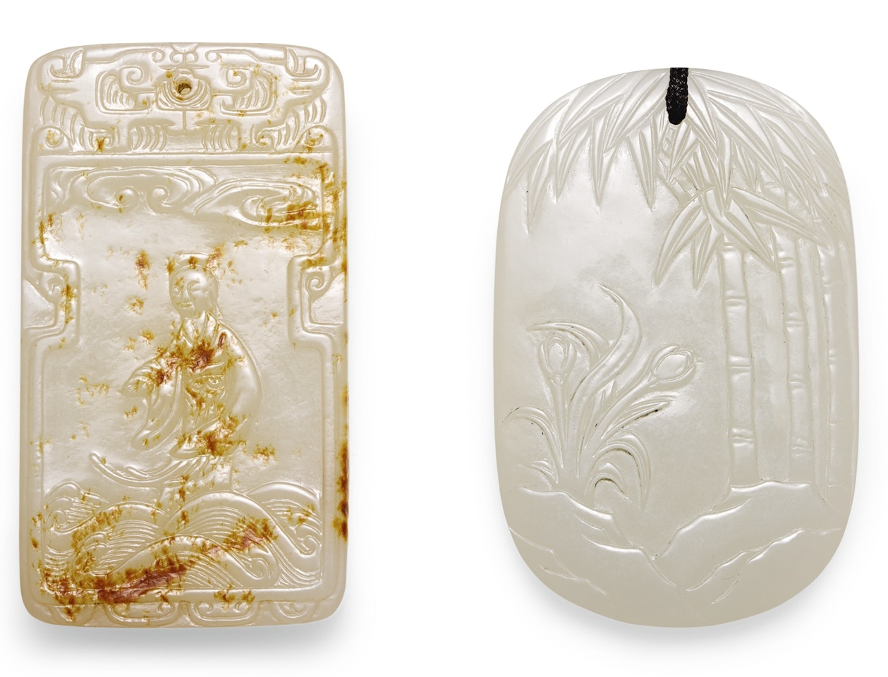 TWO PALE CELADON JADE PLAQUES by Anonymous
