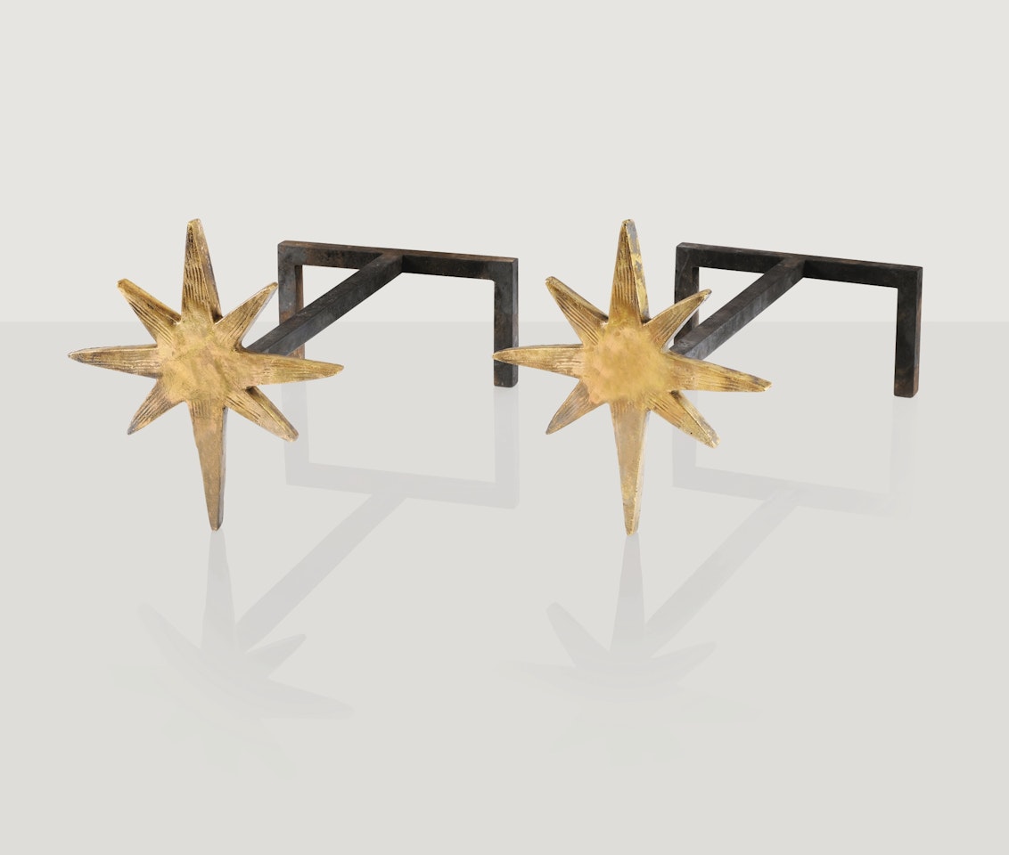 PAIR OF À L'ÉTOILE ANDIRONS by Diego Giacometti