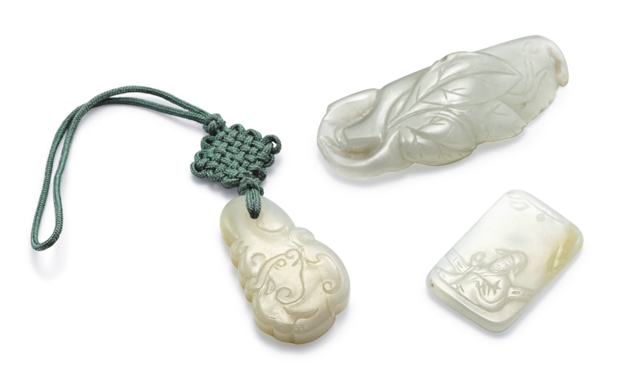 THREE WHITE JADE PENDANTS  by Anonymous