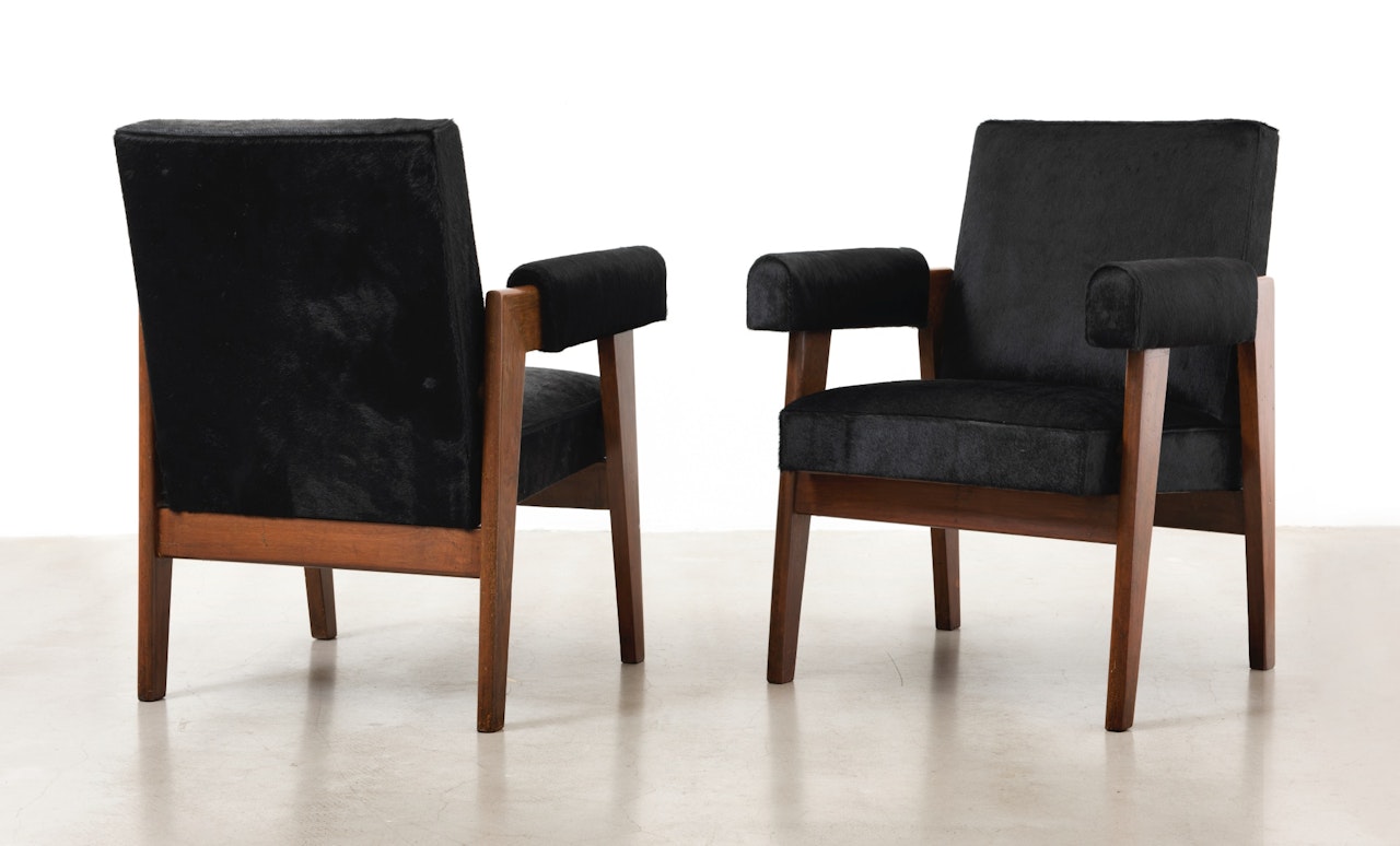 PAIR OF ADVOCATE CHAIRS (HIDE) by Pierre Jeanneret