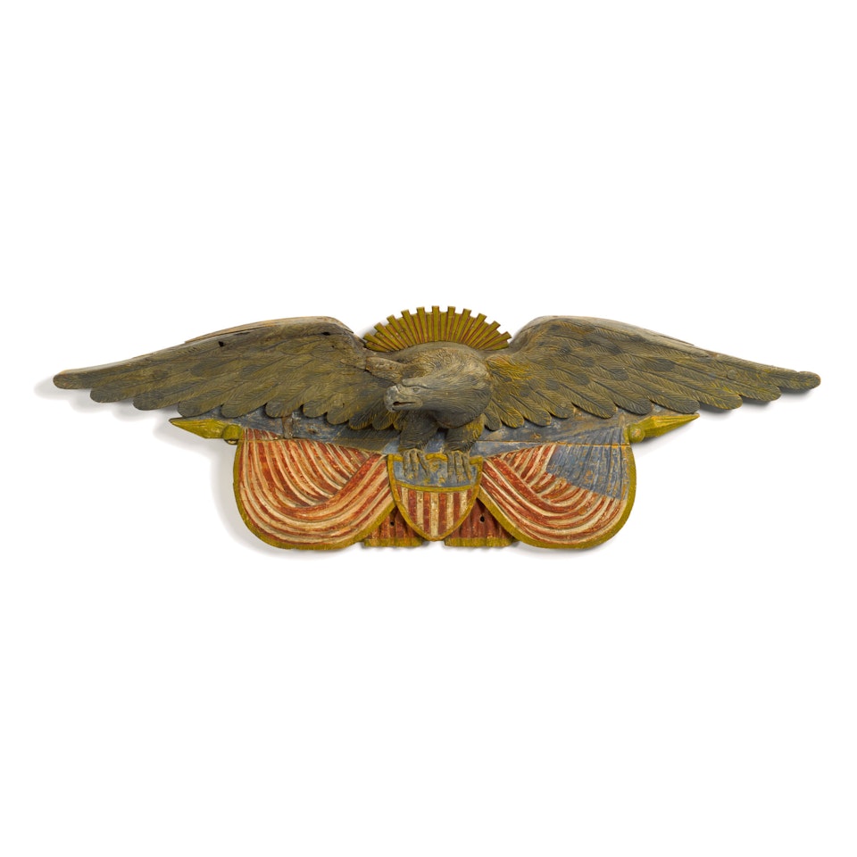 EXCEPTIONAL LARGE CARVED AND POLYCHROME PAINT-DECORATED PINE SPREAD-WINGED 'SUNBURST' AMERICAN EAGLE WALL PLAQUE, QUINCY, MASSACHUSETTS, CIRCA 1875 by Anonymous