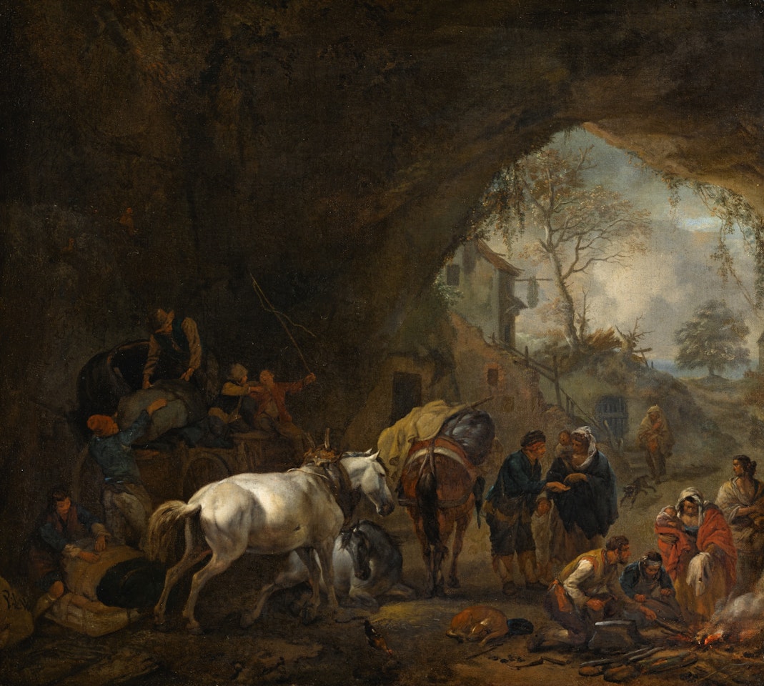 A grotto with travellers unloading a wagon, a gypsy fortune-teller, a blacksmith and other figures by Philips Wouwerman