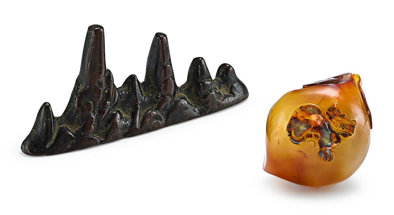 AN AGATE PEACH-FORM PAPERWEIGHT AND A BRONZE 'MOUNTAIN' BRUSHREST by Anonymous