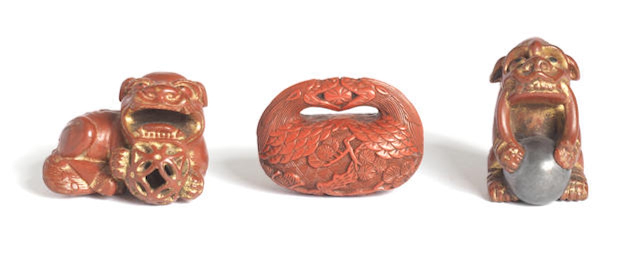 Three red-lacquer and two ivory mask netsuke by Anonymous