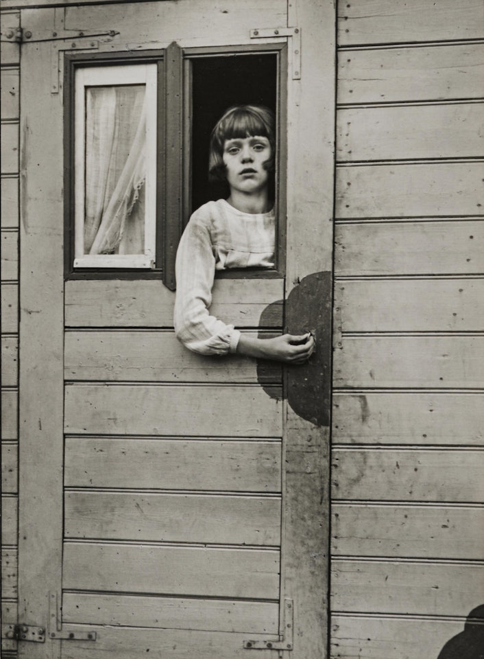 Mädchen im Zirkuswagen (Girl in a Circus Caravan), Köln by August Sander