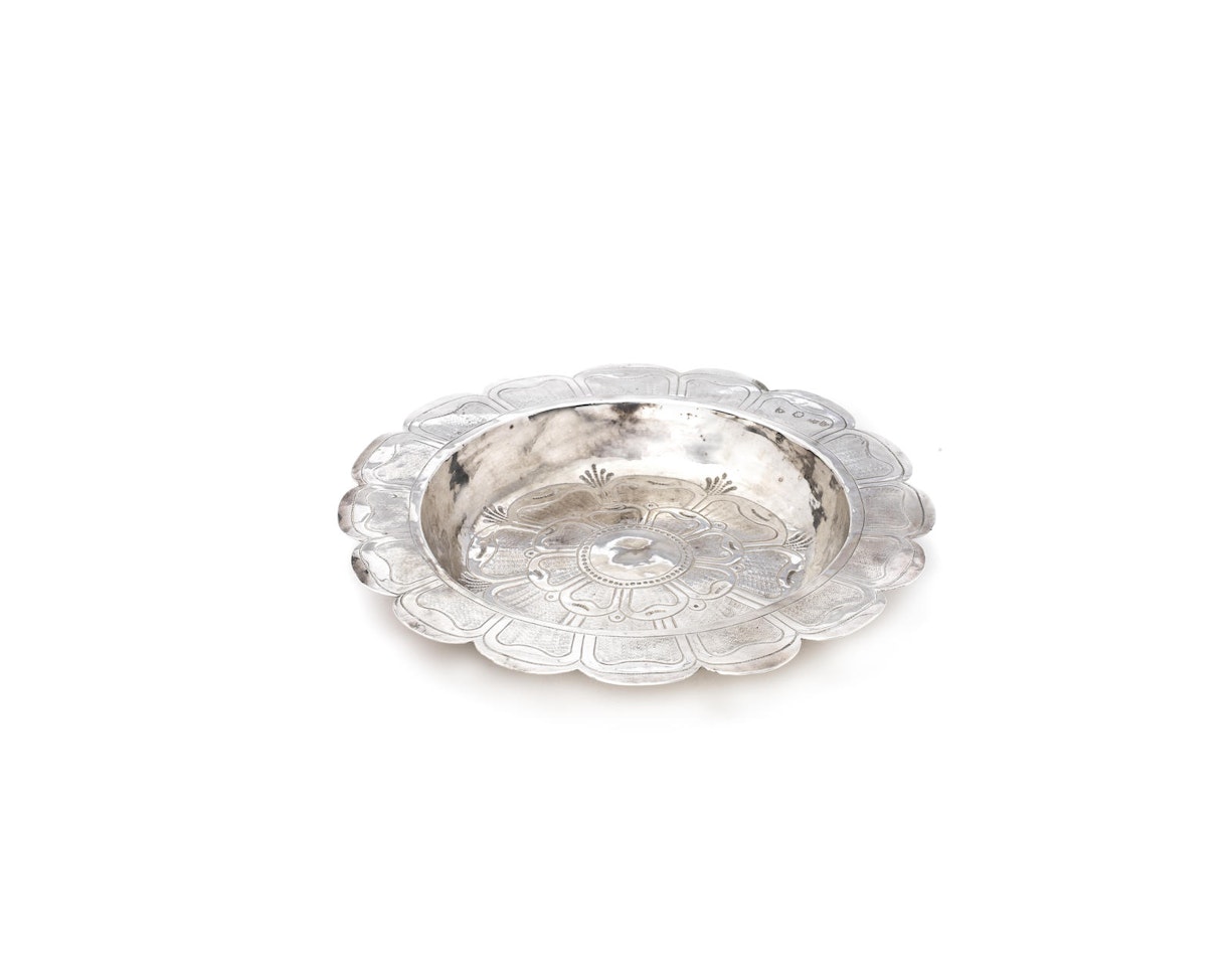 A Commonwealth silver alms dish by Anonymous