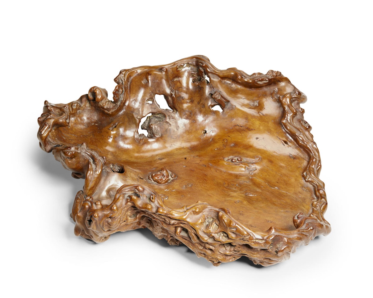 A CARVED BURLWOOD MORIBON (SERVING TRAY) by Anonymous