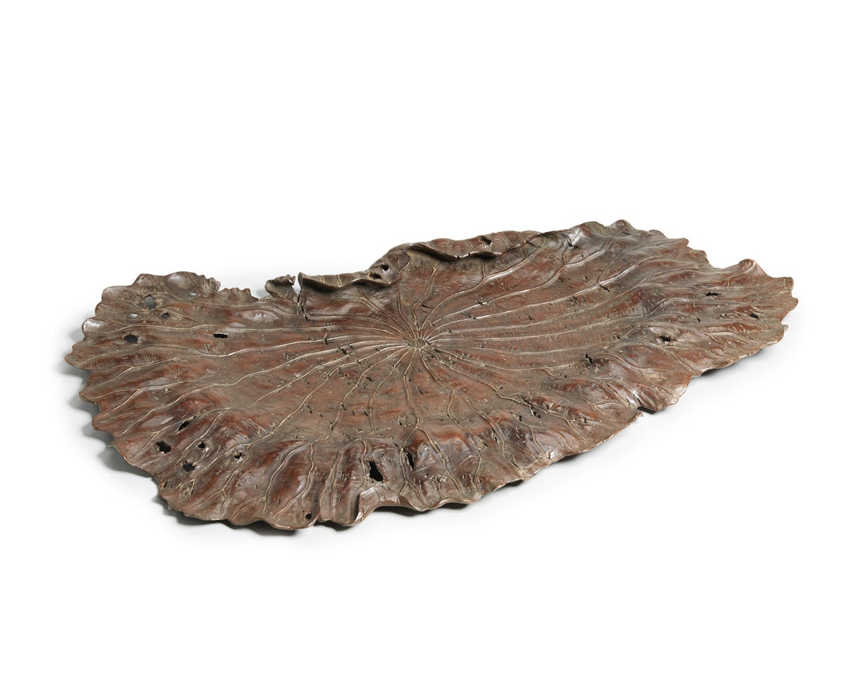 ITŌ TESSEKI
A carved burlwood tray in the form of a lotus leaf  by Anonymous