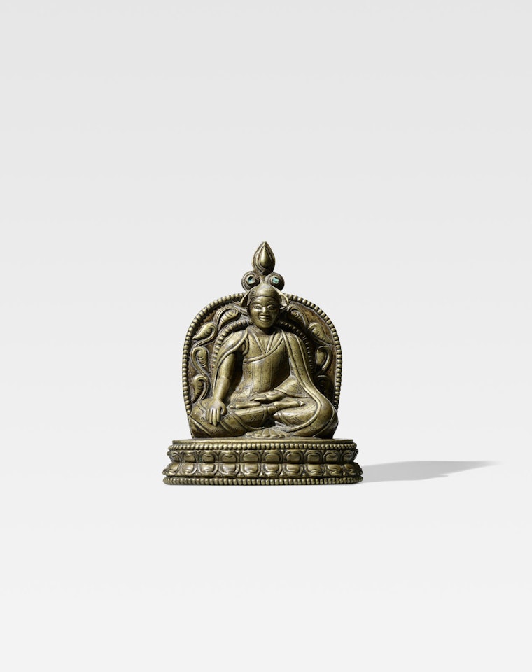 A COPPER ALLOY FIGURE OF A LAMA by Anonymous