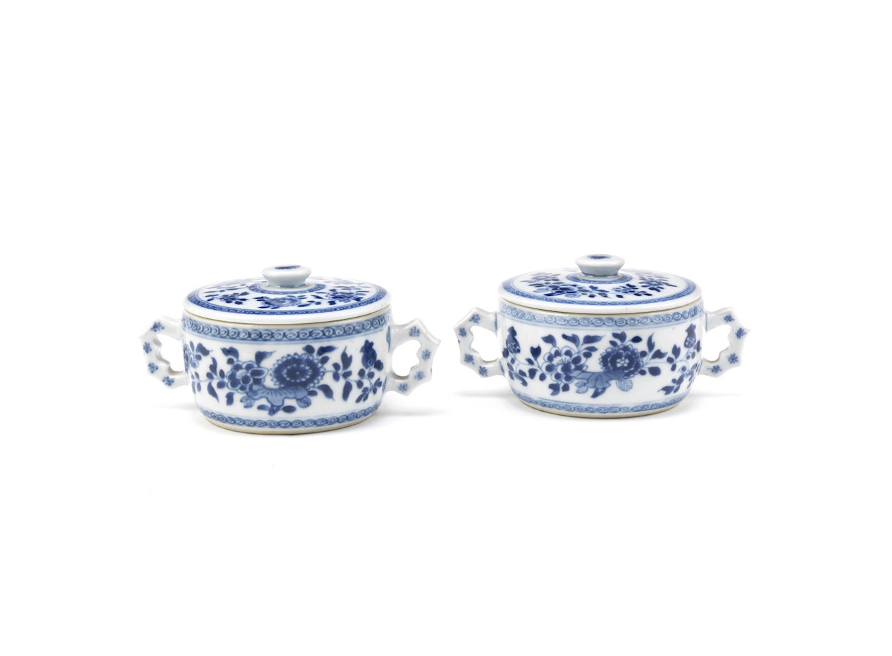 A pair of blue and white handled jars and covers by Anonymous