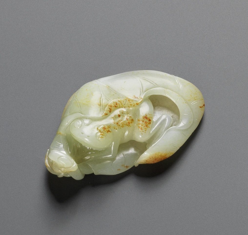 A white and russet jade 'frog and lotus' group by Anonymous