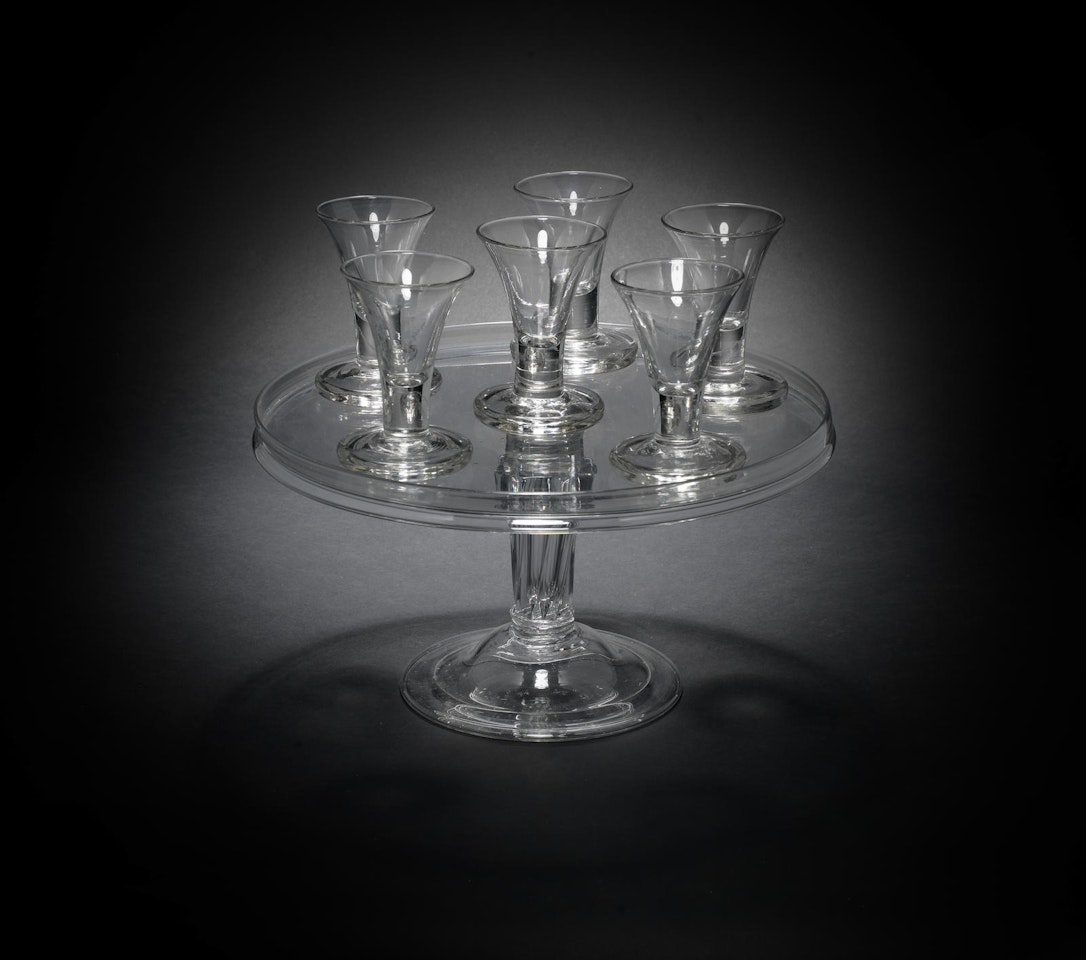 A set of six 'firing' glasses and a pedestal-stem sweetmeat stand by Anonymous