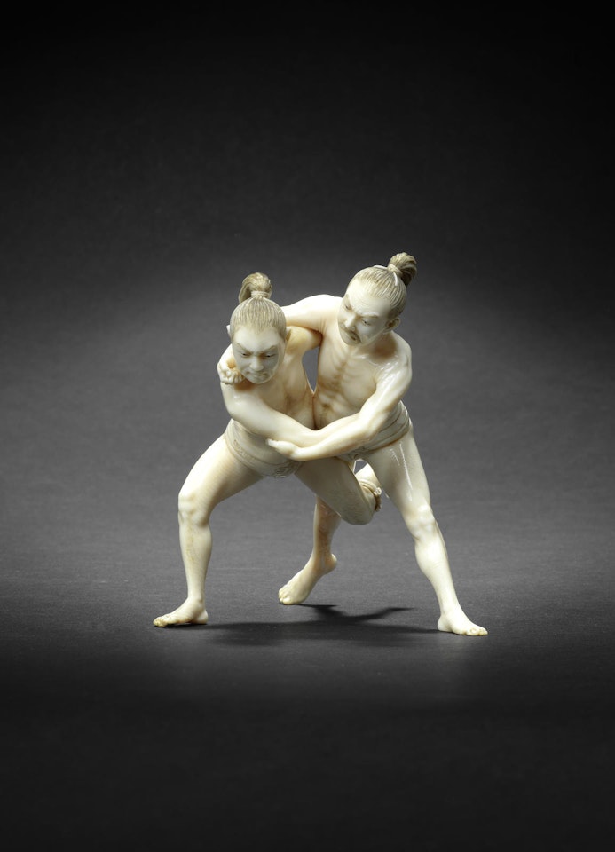 An ivory okimono figure group of two sumo wrestlers by Anonymous