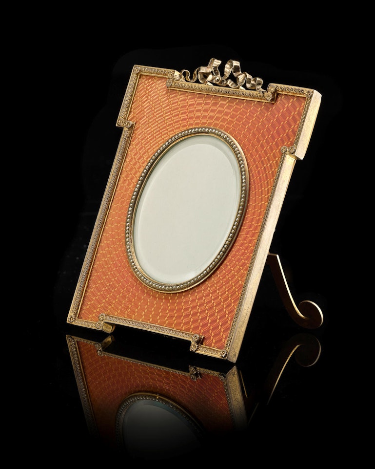 A silver-gilt and guilloché enamel photograph frame by Anonymous