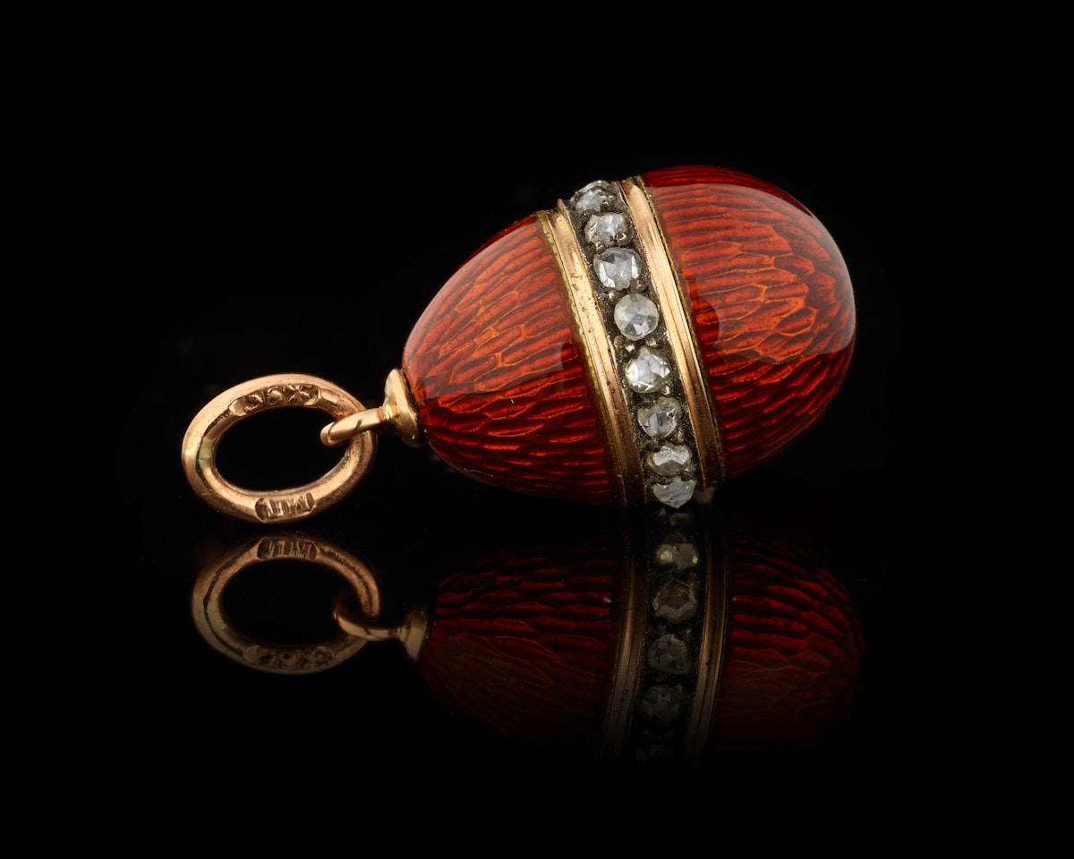A gold-mounted jewelled guilloché enamel egg pendant by Anonymous
