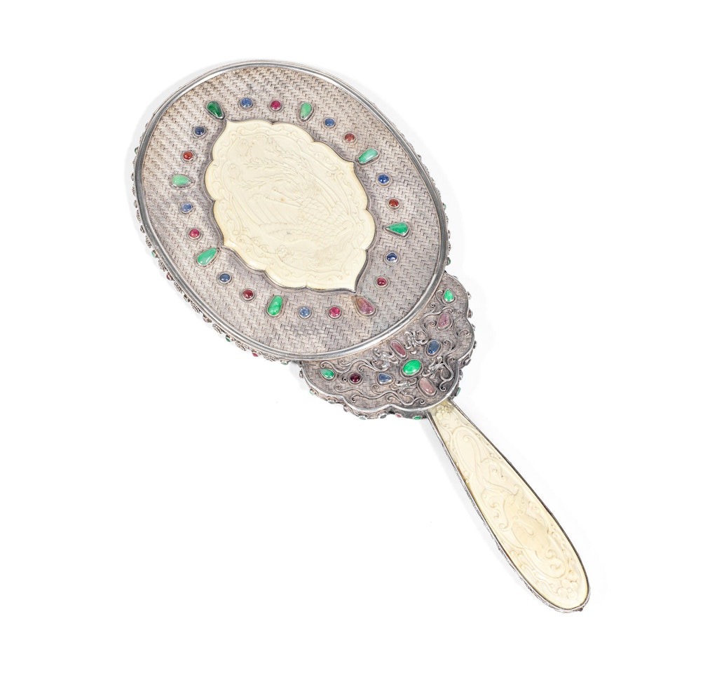 A fine hardstone-inset, ivory and silver 'dragon and phoenix' hand-mirror by Anonymous