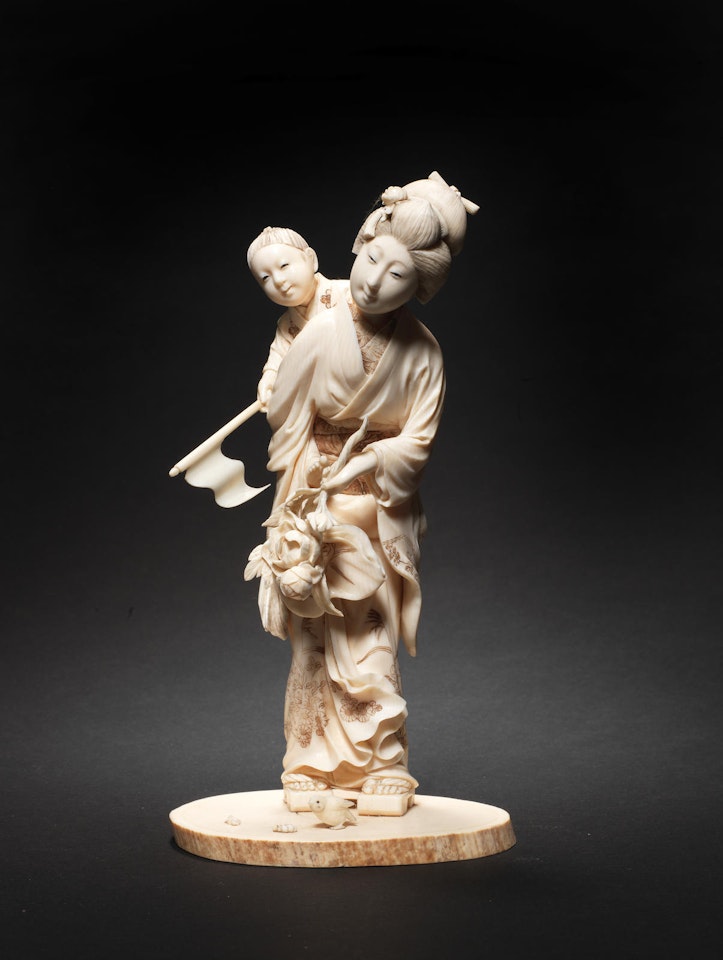 An ivory okimono figure group of a woman and child By Chikusai Nobumasa by Anonymous