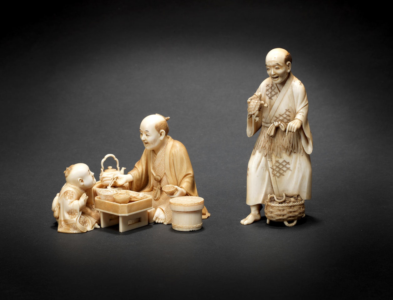 Two ivory okimono figures by Anonymous