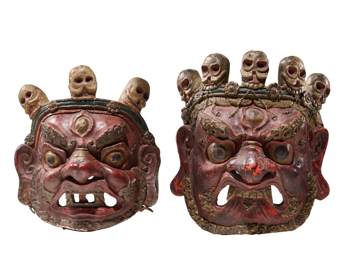 TWO POLYCHROMED PAPIER-MACHÉ RITUAL MASKS by Anonymous