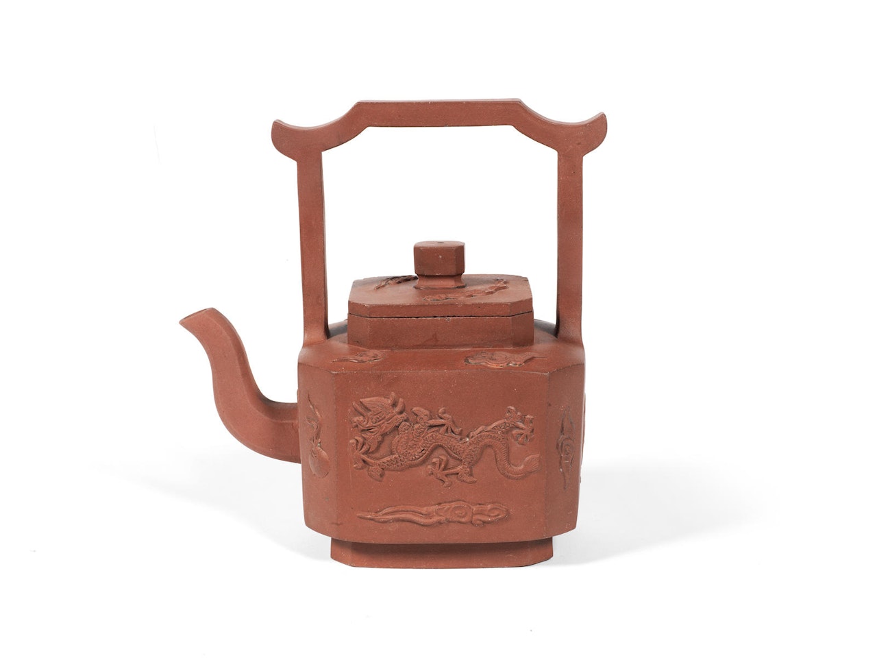 An Yixing teapot and cover with overhead handle by Anonymous
