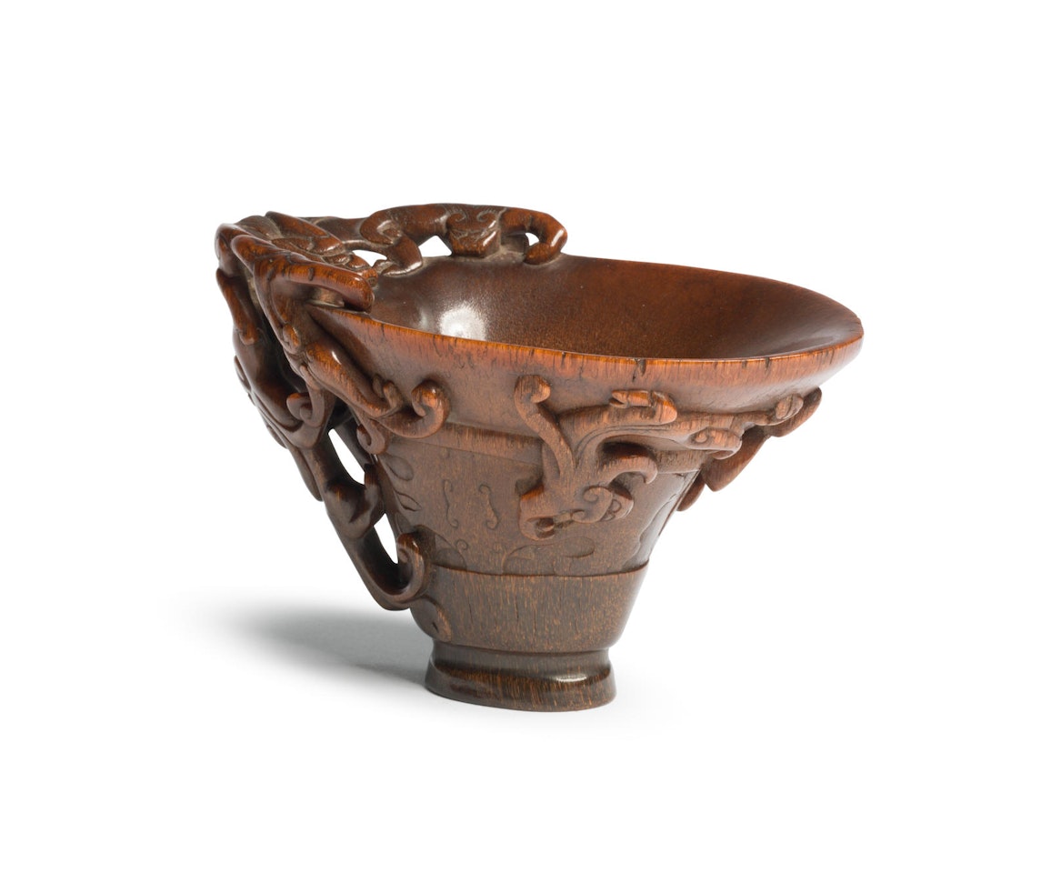 A very fine rhinoceros horn archaistic 'six-chilong' libation cup by Anonymous