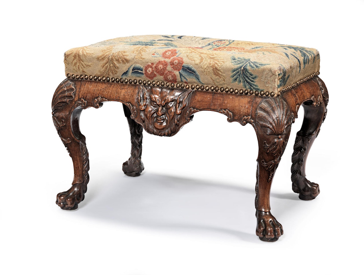 A George II carved walnut stool by Anonymous