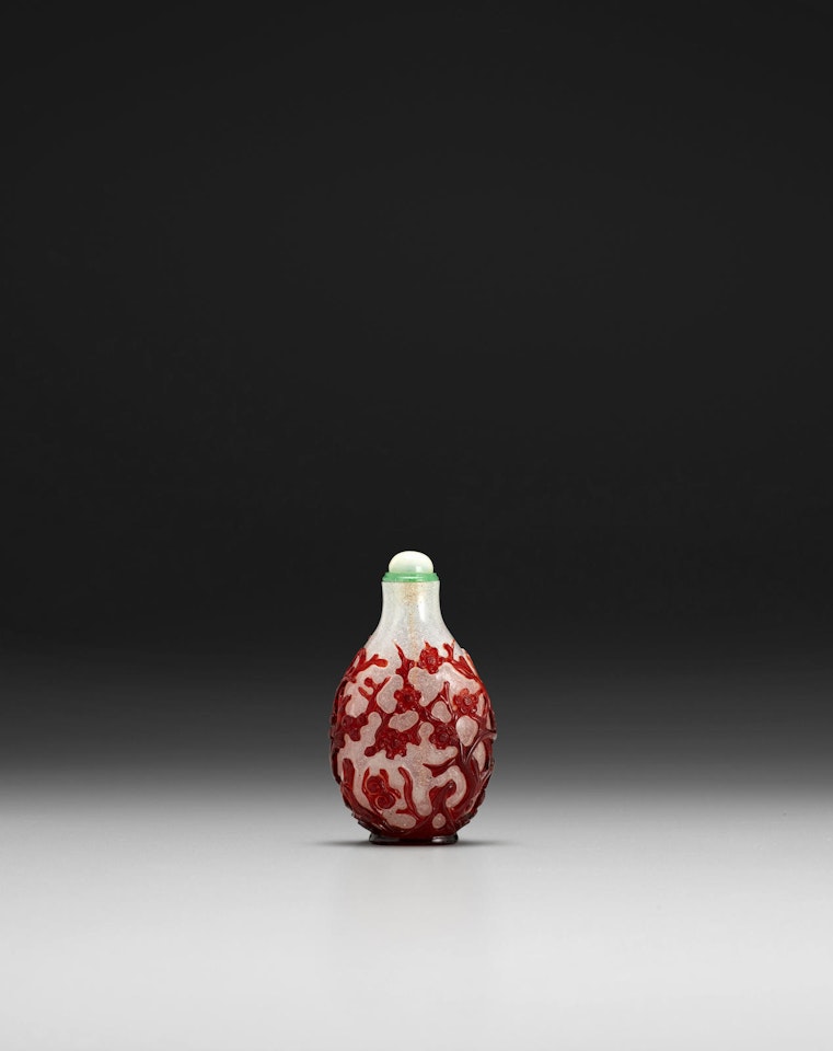 A red overlay 'snowflake' glass snuff bottle by Anonymous