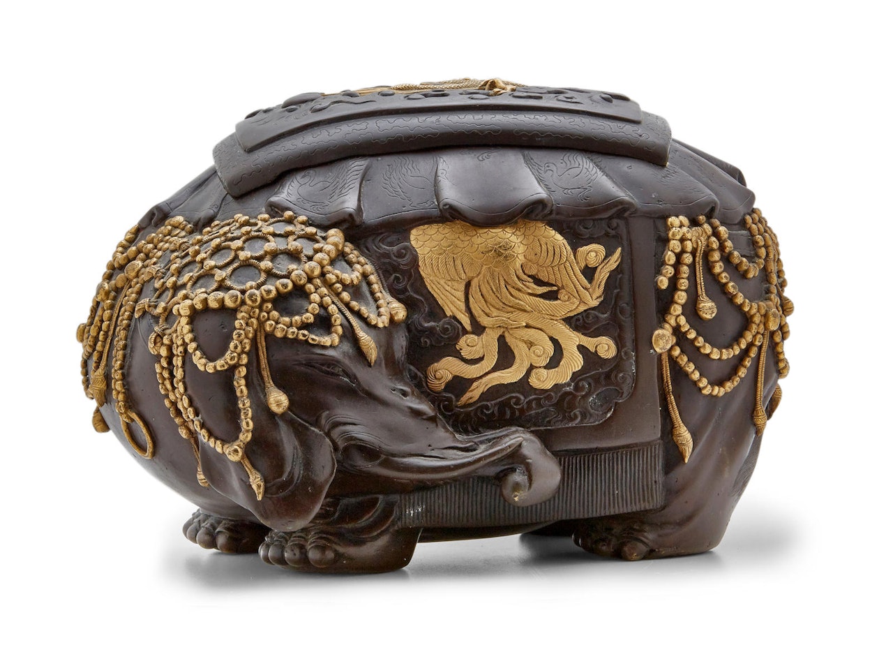An inlaid bronze incense burner by Anonymous