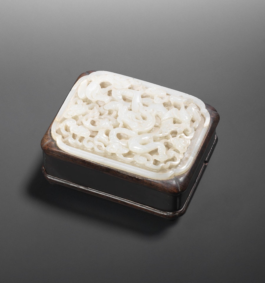 A white jade 'dragon and phoenix' plaque by Anonymous