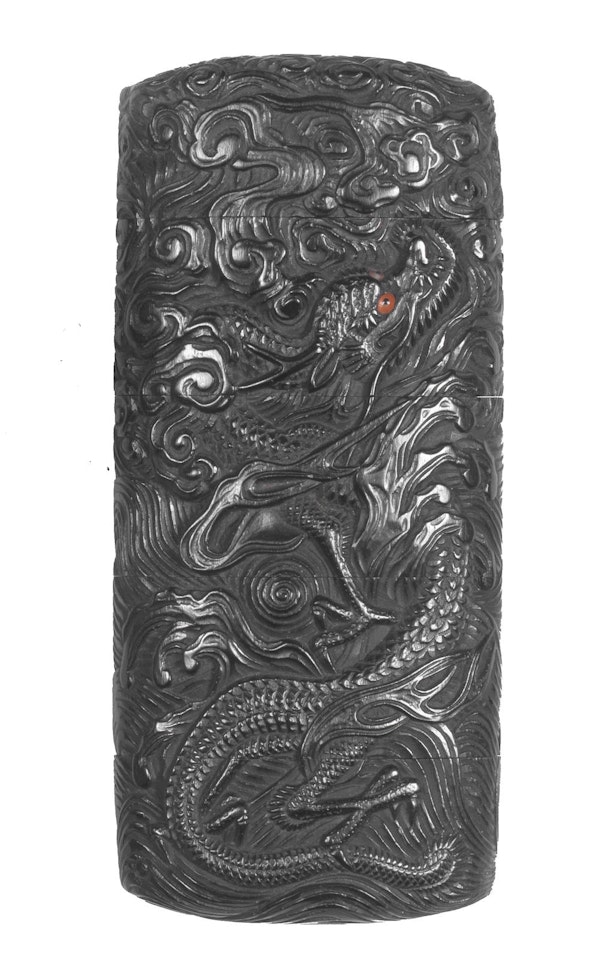 An ebony four-case inro  by Anonymous