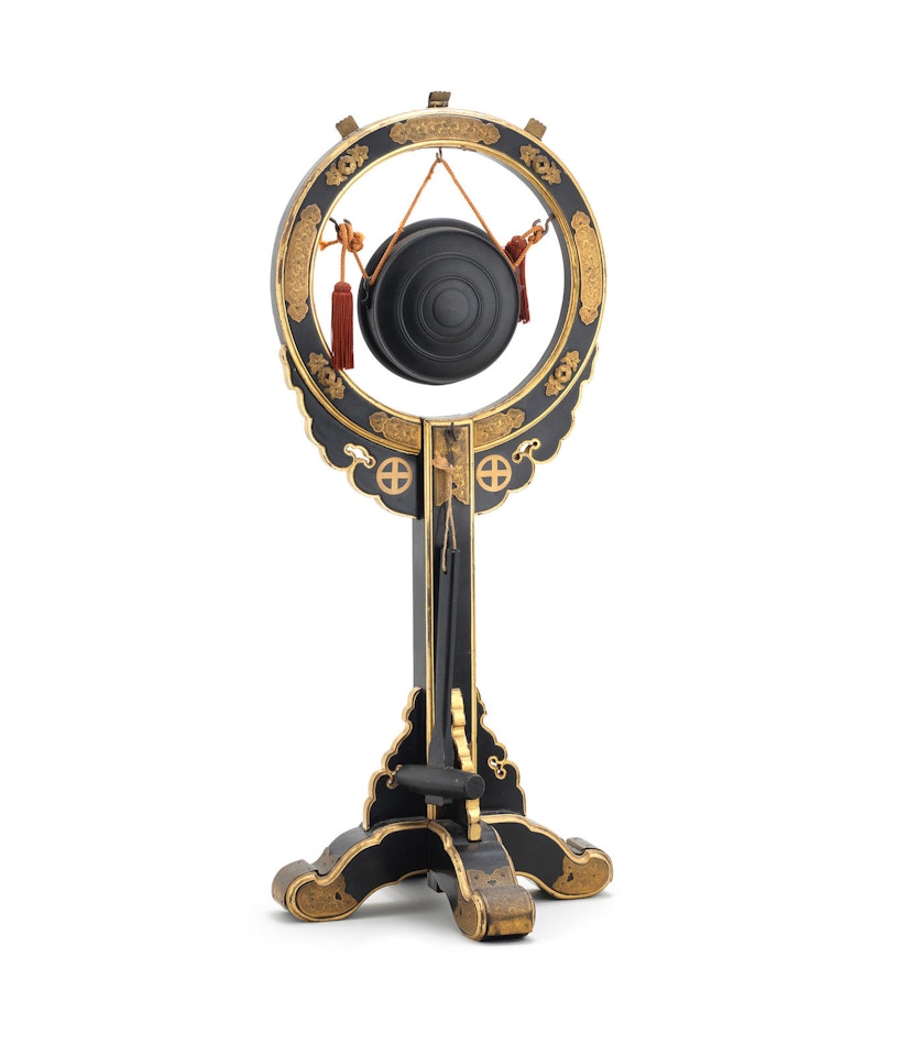 A small gong in a black-lacquer stand by Anonymous
