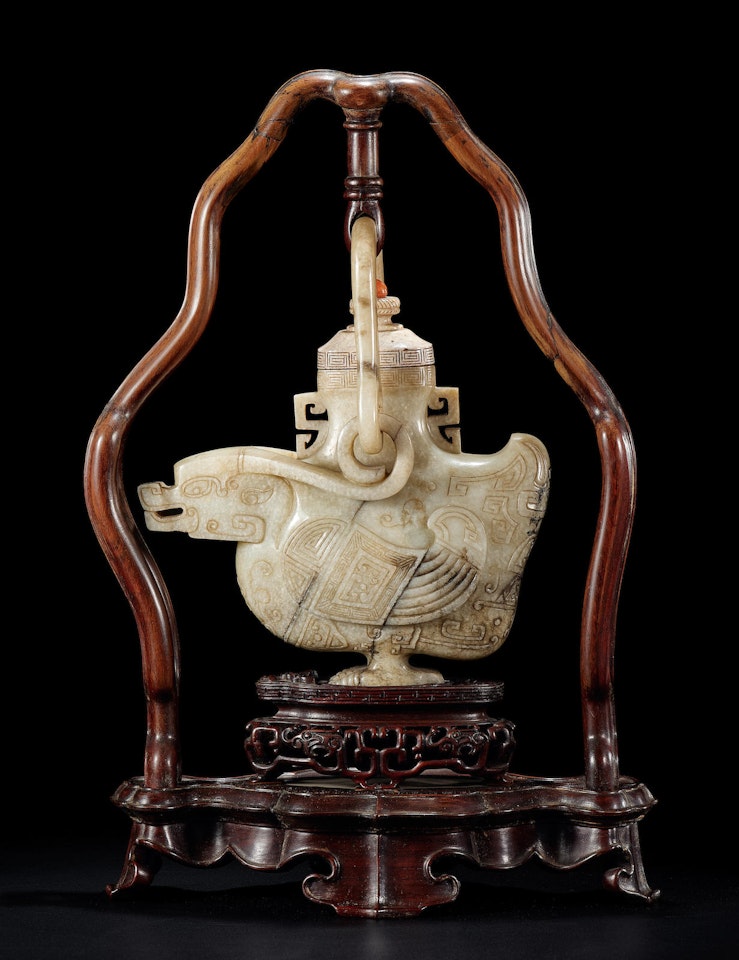 A rare archaistic 'burnt' jade duck-shaped vase and cover by Anonymous